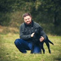 man-with-black-dog