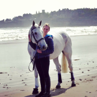 woman-with-white-horse-on-a-beach